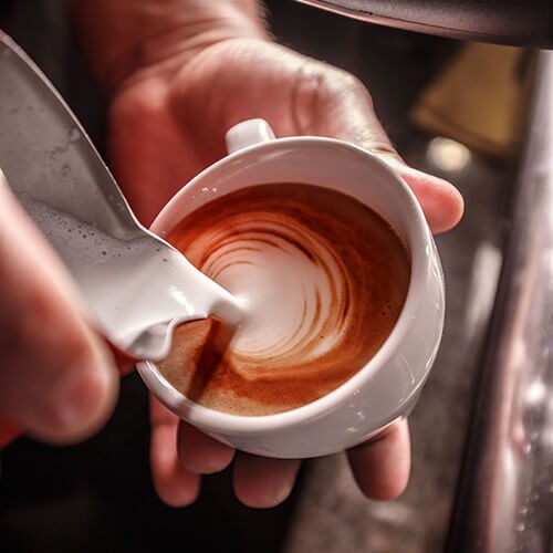 barista-makes-coffee-latte-art-PLE8Y3P.jpg